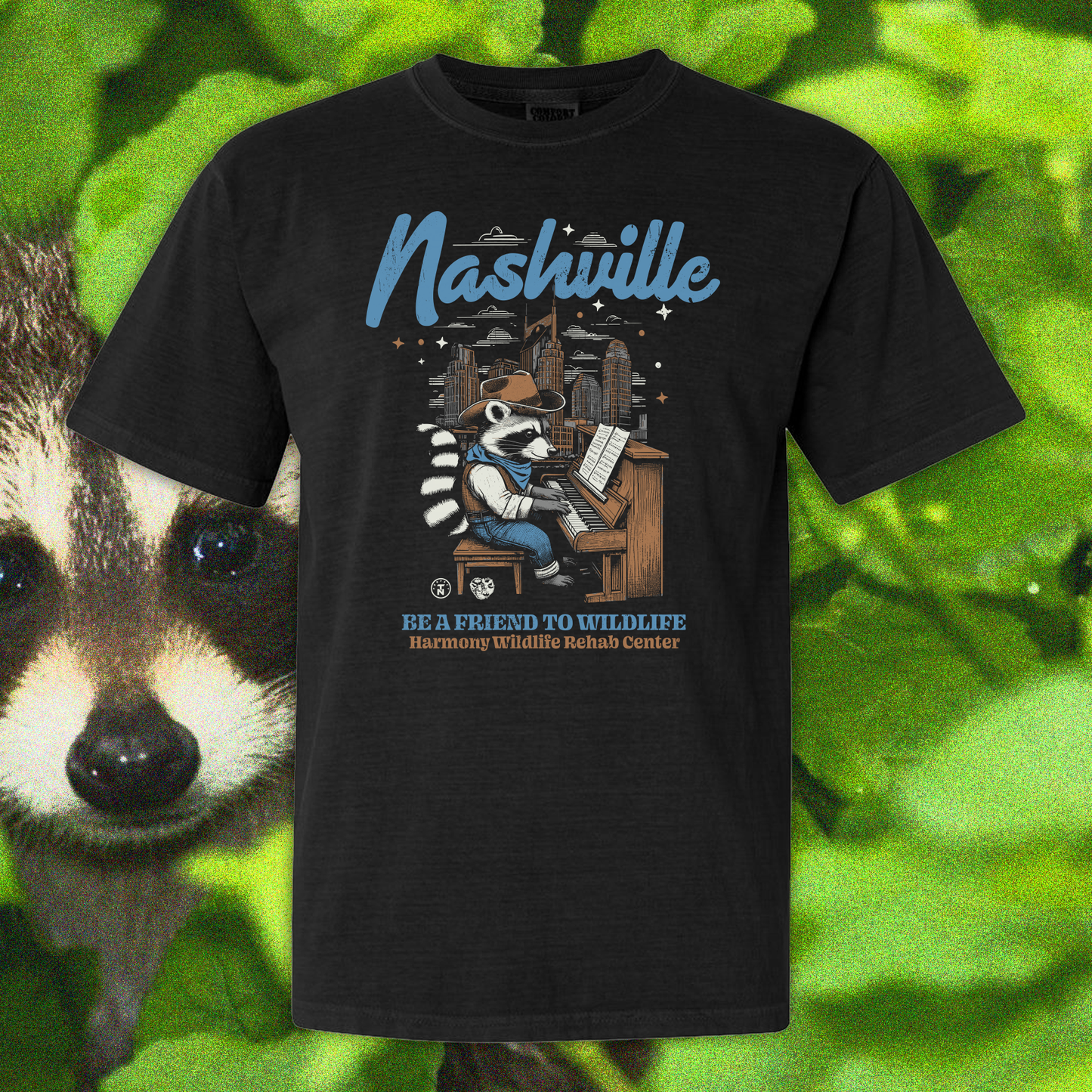 Be a Friend to Wildlife; Harmony Wildlife Raccoon on Piano Tee